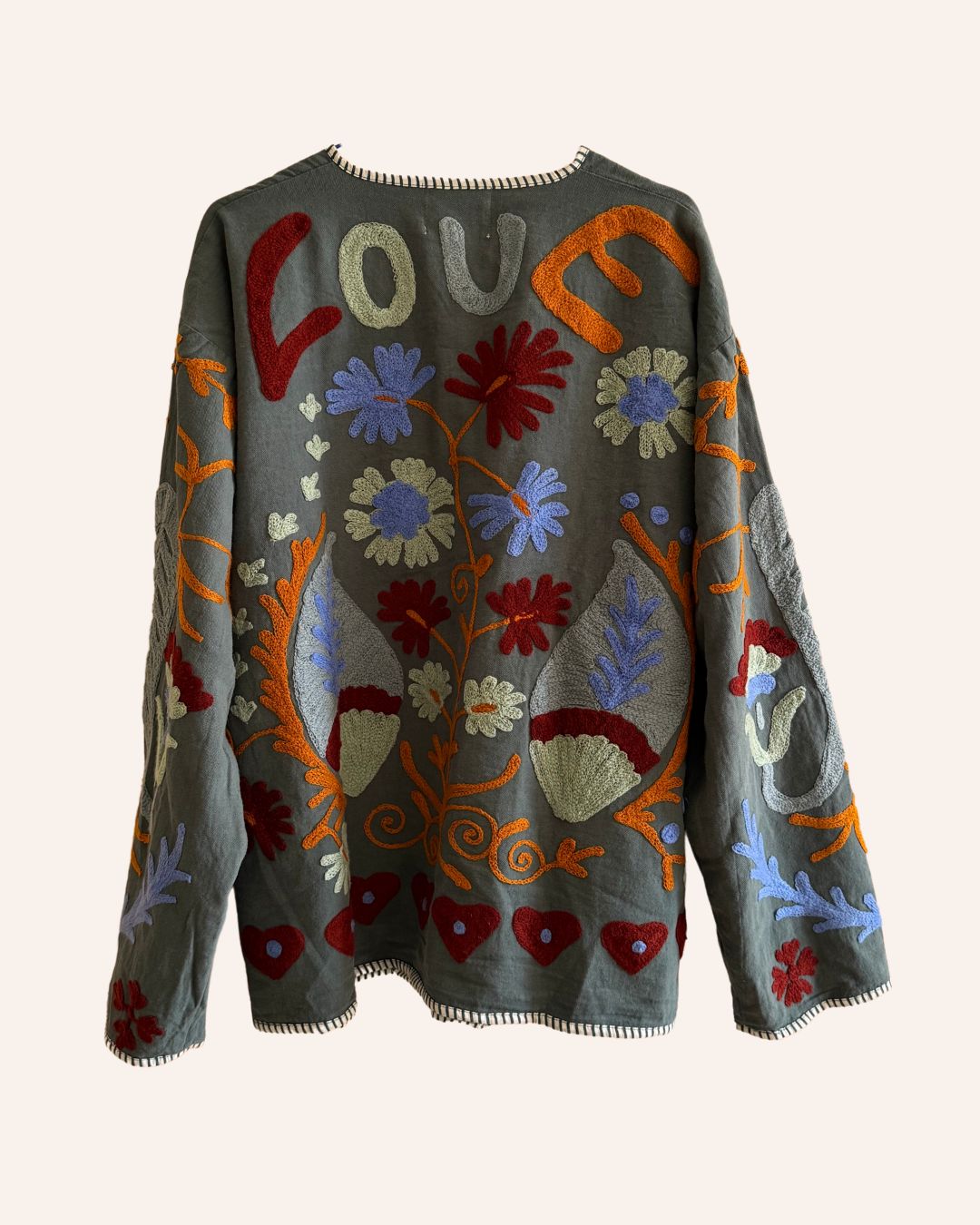 Back view of reversible jacket showing alternate earthy pattern side