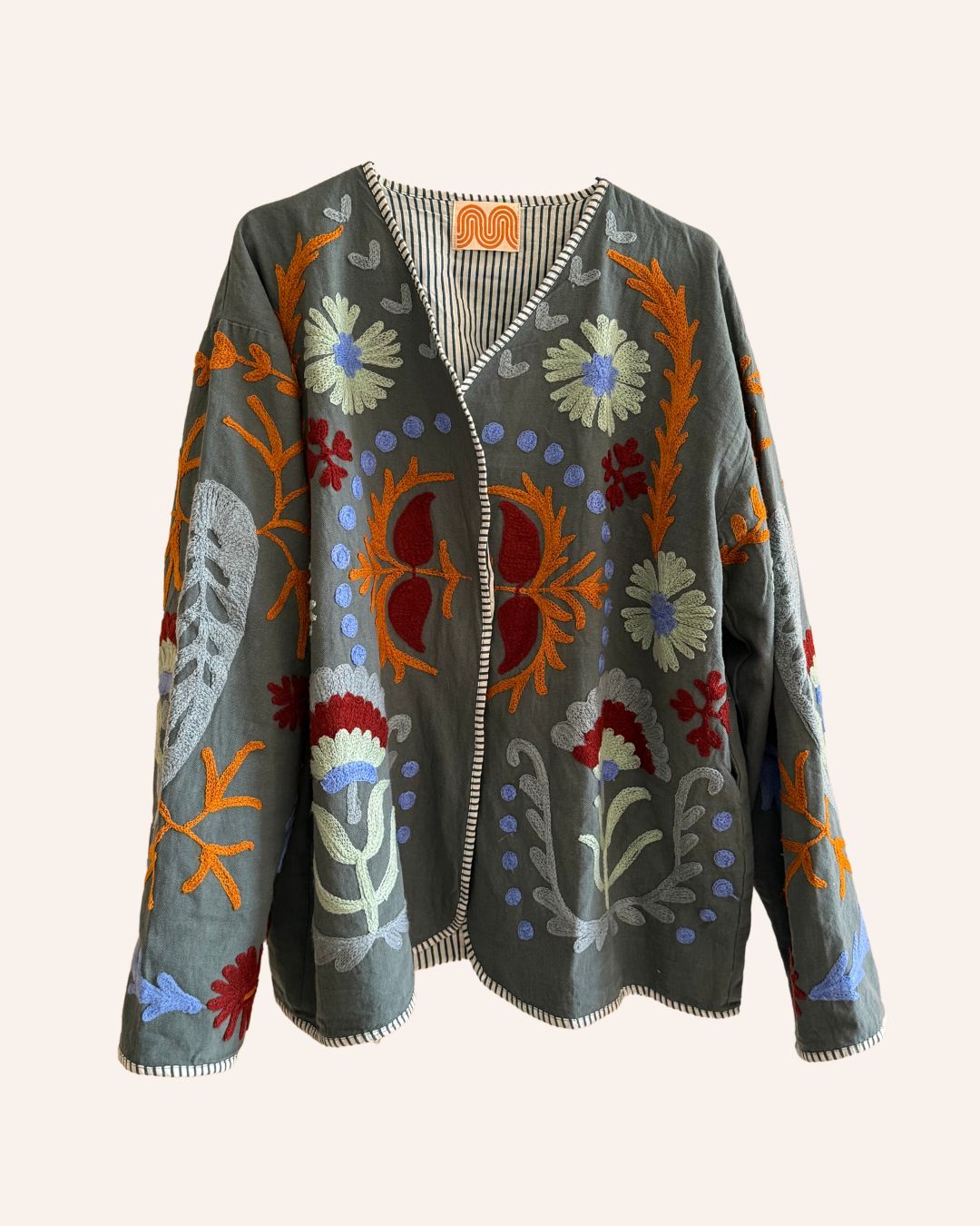 Front view of reversible vintage jacket with colorful patchwork design