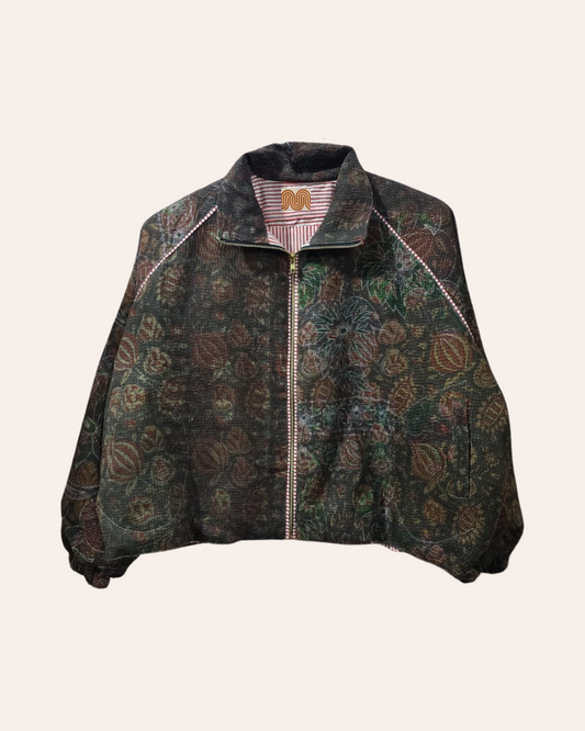 Dark botanical print bomber jacket with subtle floral patterns