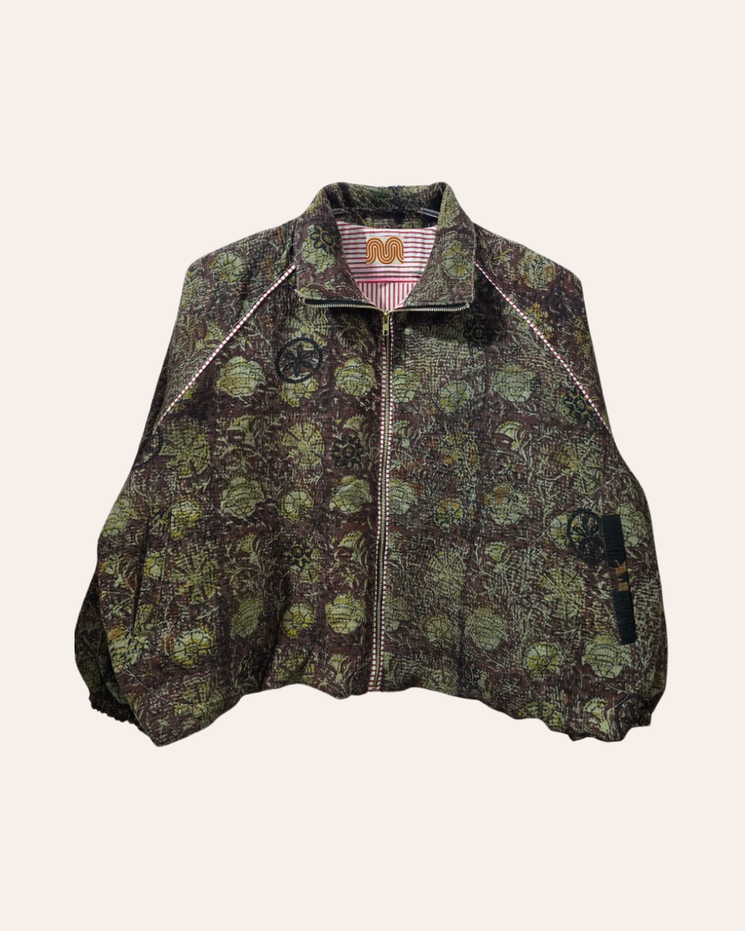 Green and brown floral bomber jacket with artisan stitch detailing